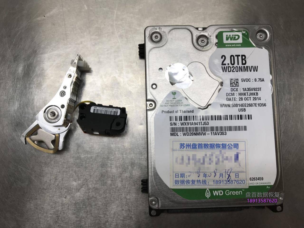 西数My passport 2TB移动硬盘WD20NMVW-11AV3S3原生USB接口磁头损坏变形划伤盘片!总共报废损坏了5块同型号的配件硬盘才把数据恢复成功。 西数My passport 2TB移动硬盘WD20NMVW-11AV3S3磁头损坏划伤盘片数据恢复成功