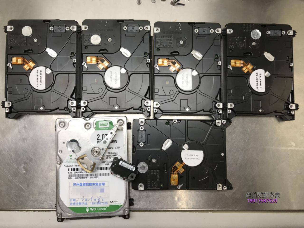 西数My passport 2TB移动硬盘WD20NMVW-11AV3S3原生USB接口磁头损坏变形划伤盘片!总共报废损坏了5块同型号的配件硬盘才把数据恢复成功。 西数My passport 2TB移动硬盘WD20NMVW-11AV3S3磁头损坏划伤盘片数据恢复成功